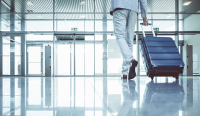 A person walking with luggage